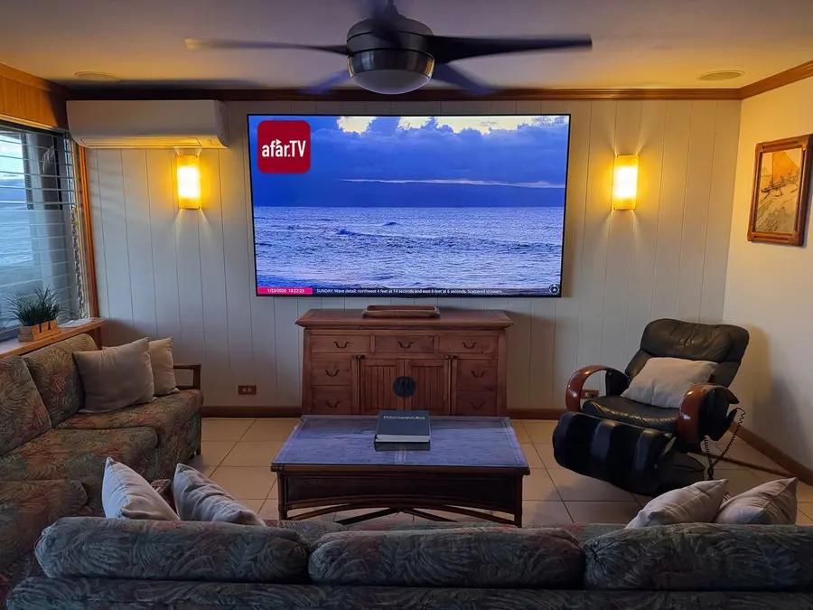 100-inch television and oceanfront living room
